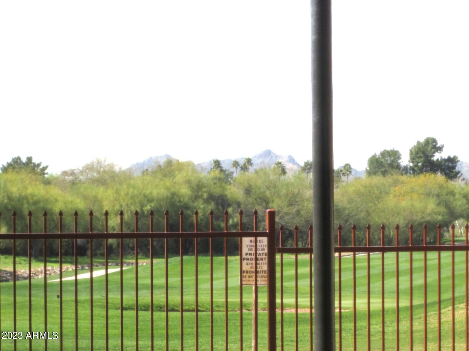 4303 East Cactus Road, Unit 137 Phoenix, AZ 85032 - Photo 11 of 22 9 137 VIEW OF COURSE WITH MOUNTAINS BEYO