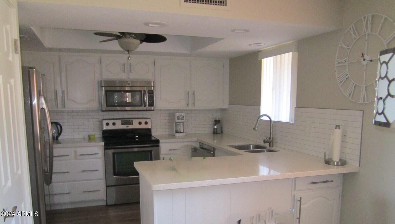 4303 East Cactus Road, Unit 137 Phoenix, AZ 85032 - Photo 4 of 22 9-137N KITCHEN