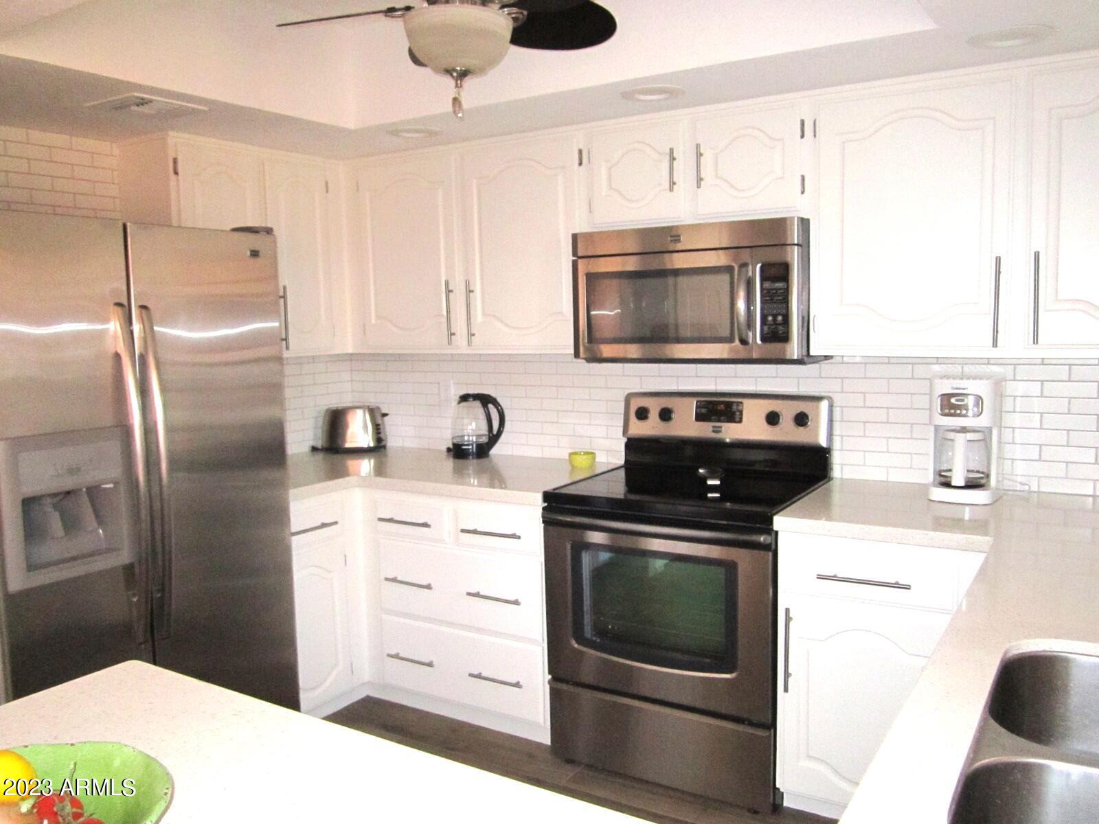 4303 East Cactus Road, Unit 137 Phoenix, AZ 85032 - Photo 5 of 22 9 137 STAINLESS KITCHEN