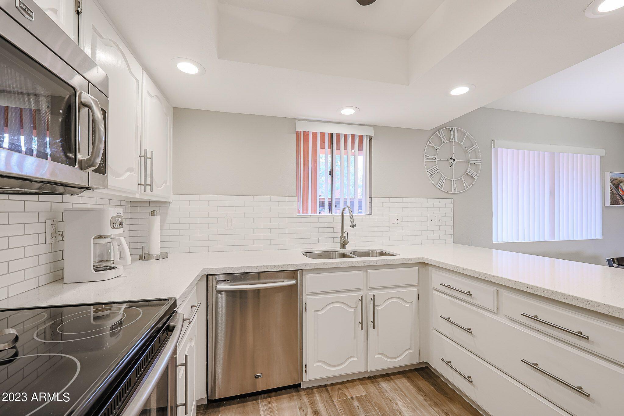 4303 East Cactus Road, Unit 137 Phoenix, AZ 85032 - Photo 7 of 22 9-137 WHITE BACKSPLASH