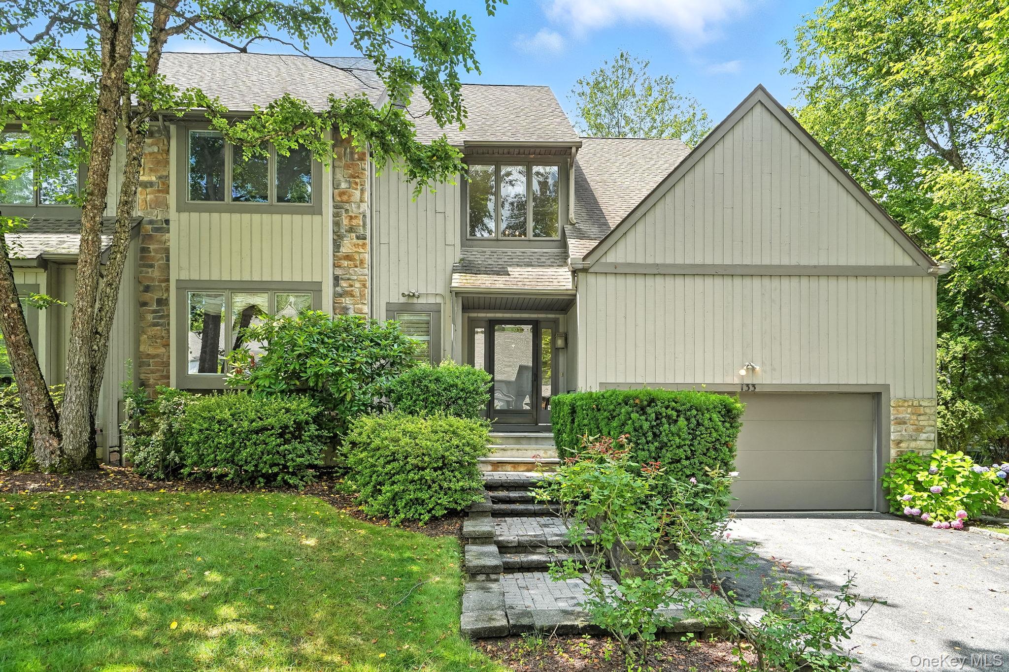 133 Woodbrook Road White Plains, NY 10605 - Photo 1 of 1 a front view of a house with garden