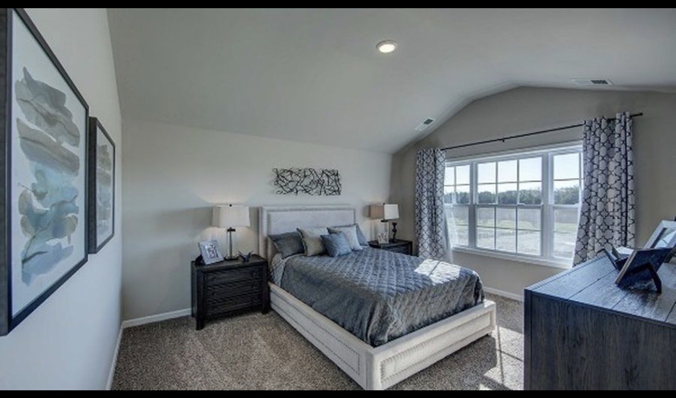 4107 Grapevine Loop Smyrna, TN 37167 - Photo 11 of 12 a bedroom with a bed window and a table in it