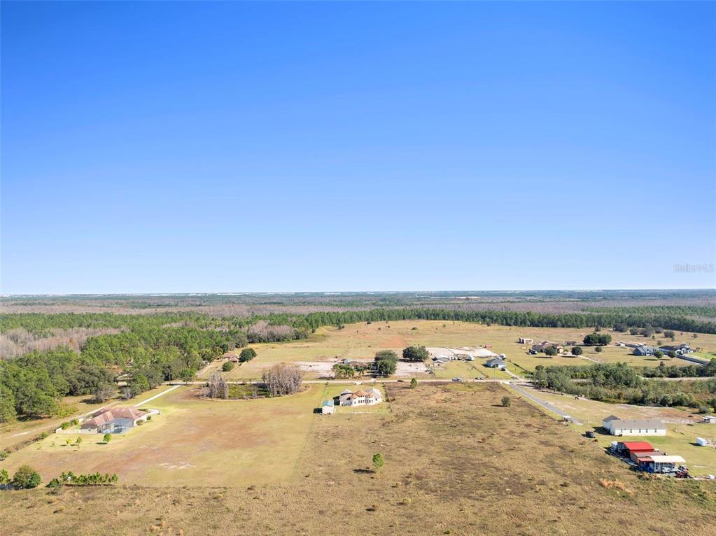 13023 Sweet Hill Road Polk City, FL 33868 - Photo 11 of 49 an ocean beach with an outdoor seating