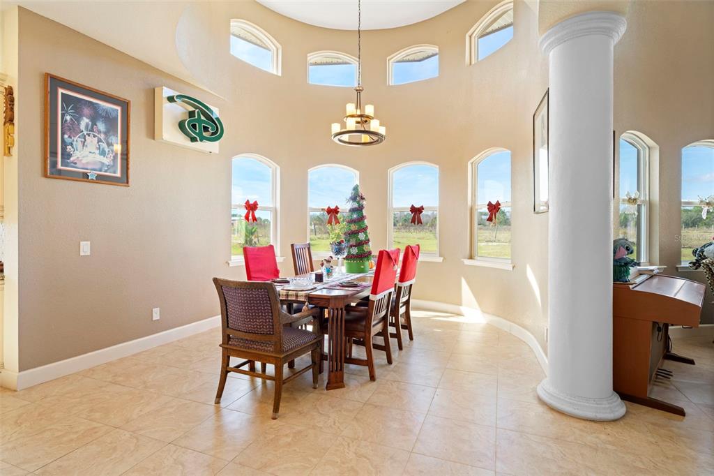 13023 Sweet Hill Road Polk City, FL 33868 - Photo 19 of 49 a view of a dining room with furniture