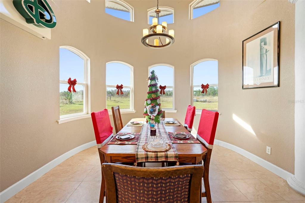13023 Sweet Hill Road Polk City, FL 33868 - Photo 20 of 49 a view of a dining room with furniture