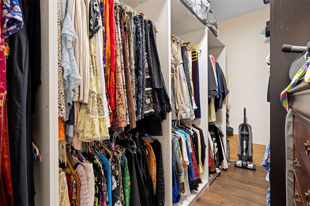 13023 Sweet Hill Road Polk City, FL 33868 - Photo 29 of 49 a view of walk in closet with clothes