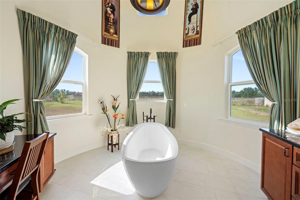 13023 Sweet Hill Road Polk City, FL 33868 - Photo 31 of 49 a living room with a couch and a large window
