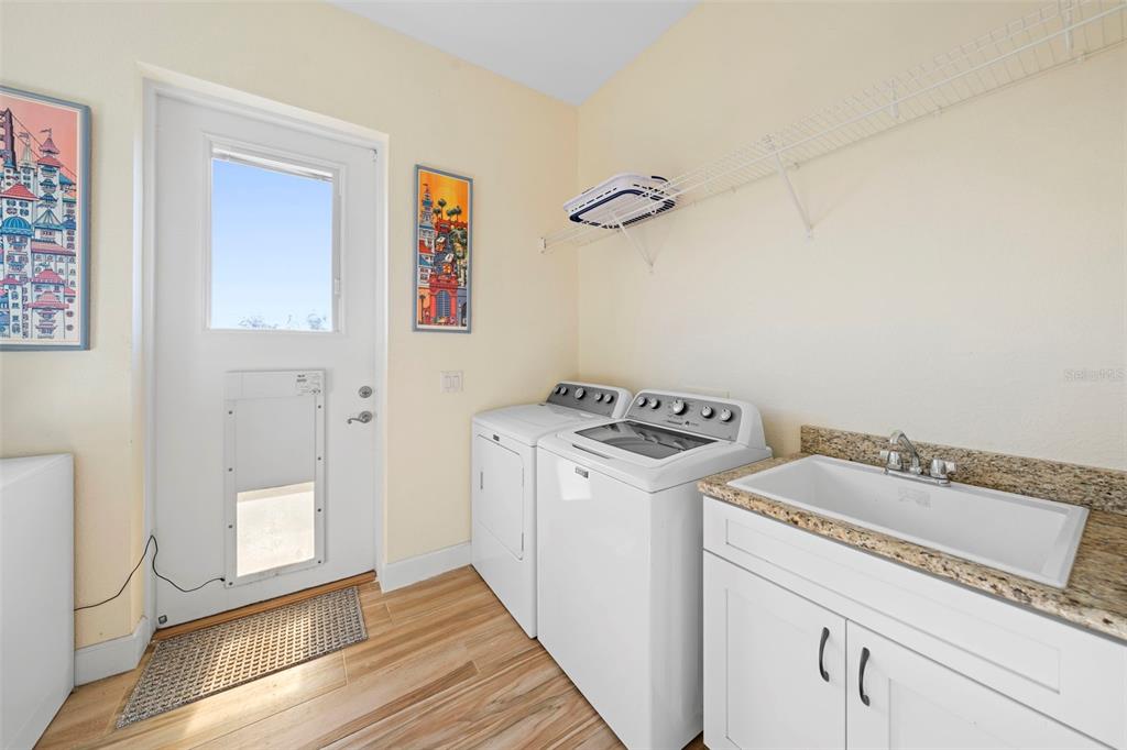 13023 Sweet Hill Road Polk City, FL 33868 - Photo 33 of 49 a utility room with dryer and washer