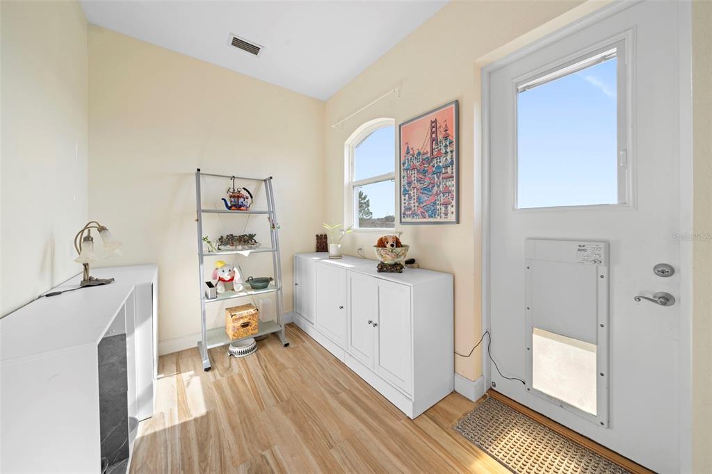 13023 Sweet Hill Road Polk City, FL 33868 - Photo 34 of 49 a room with furniture and a window