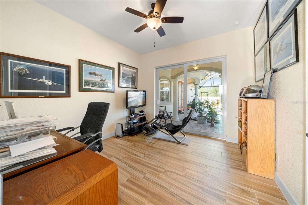 13023 Sweet Hill Road Polk City, FL 33868 - Photo 38 of 49 a view of a workspace with furniture and a window
