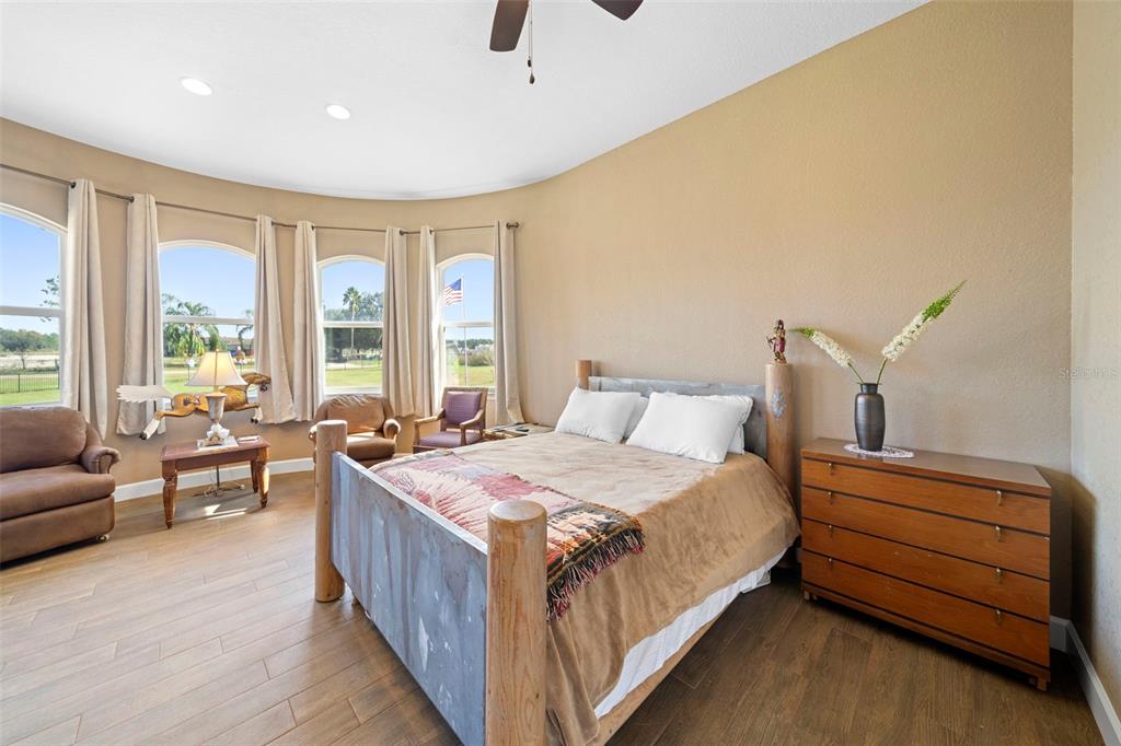 13023 Sweet Hill Road Polk City, FL 33868 - Photo 43 of 49 a bedroom with bed and window