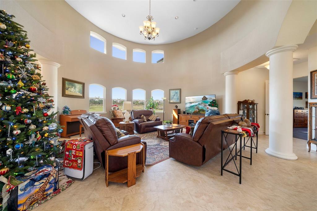 13023 Sweet Hill Road Polk City, FL 33868 - Photo 47 of 49 a living room with furniture and a potted plant