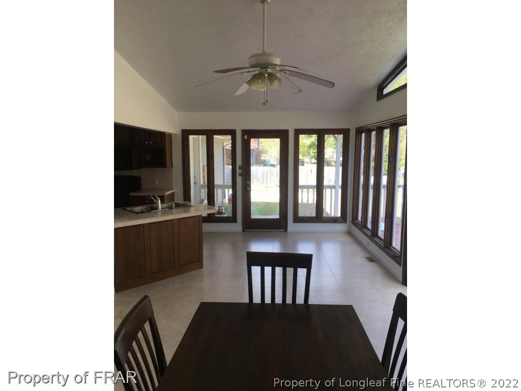 322 Old Farm Road Raeford, NC 28376 - Photo 7 of 11 a view of a dining room with furniture window and wooden floor