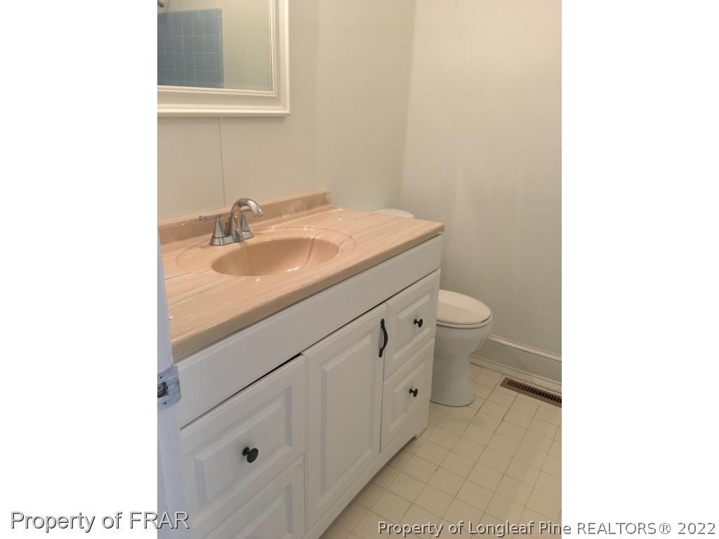 322 Old Farm Road Raeford, NC 28376 - Photo 8 of 11 a bathroom with a sink and a toilet