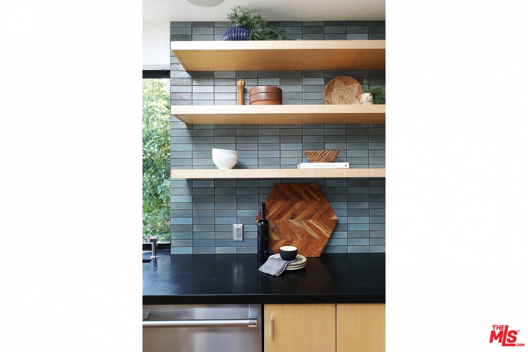 1508 Elevado Street Los Angeles, CA 90026 - Photo 13 of 38 a room with a sink and a mirror