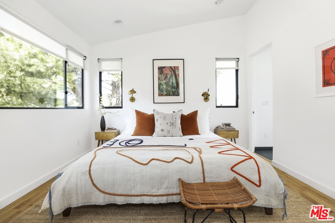 1508 Elevado Street Los Angeles, CA 90026 - Photo 18 of 38 a bedroom with a bed and wooden floor