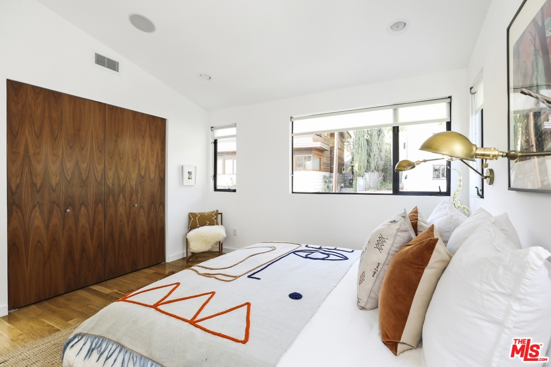 1508 Elevado Street Los Angeles, CA 90026 - Photo 19 of 38 a bedroom with a bed and lamp