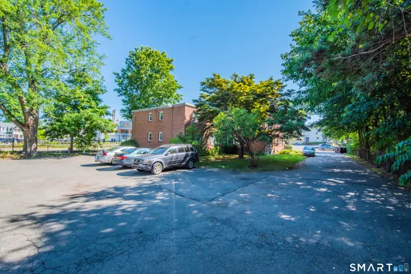 a view of a tree in front of a house
