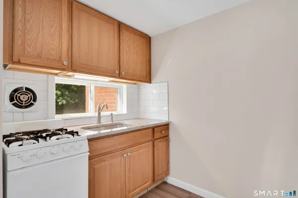 a kitchen with a stove and a sink