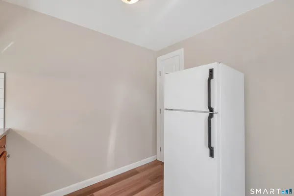 a white refrigerator freezer and a dishwasher sitting inside of a kitchen
