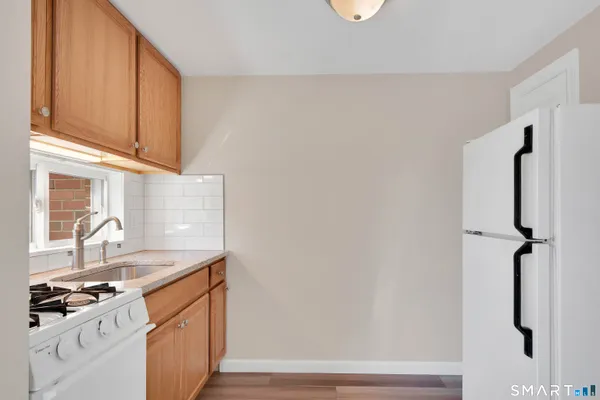a kitchen with a sink and a stove top oven