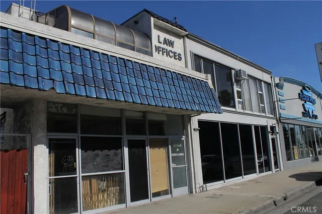 a front view of a house with large windows