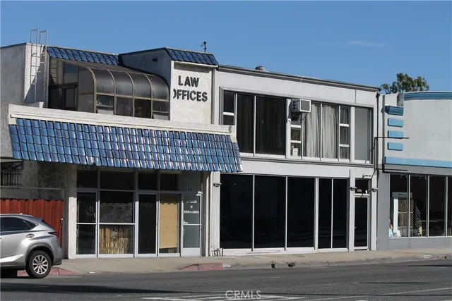 a view of a car parked in front of a building