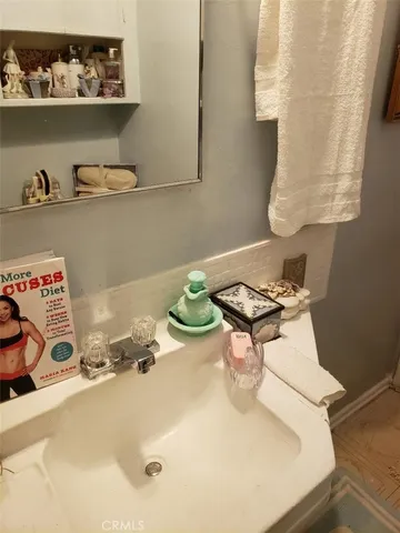 a room with a rug and a mirror