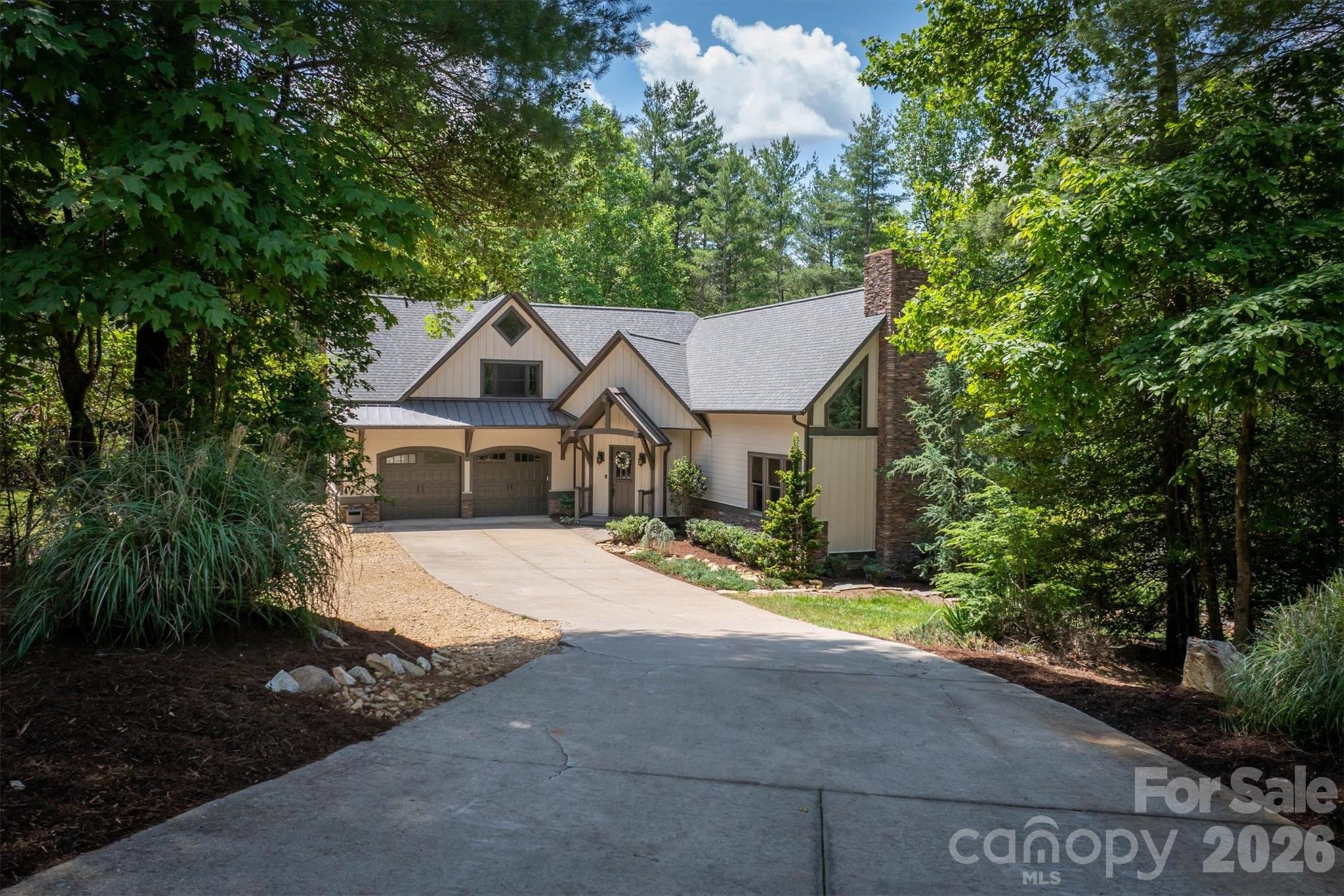 2243 Cottage Park Road Morganton, NC 28655 - Photo 1 of 48 a front view of a house with a yard and garage