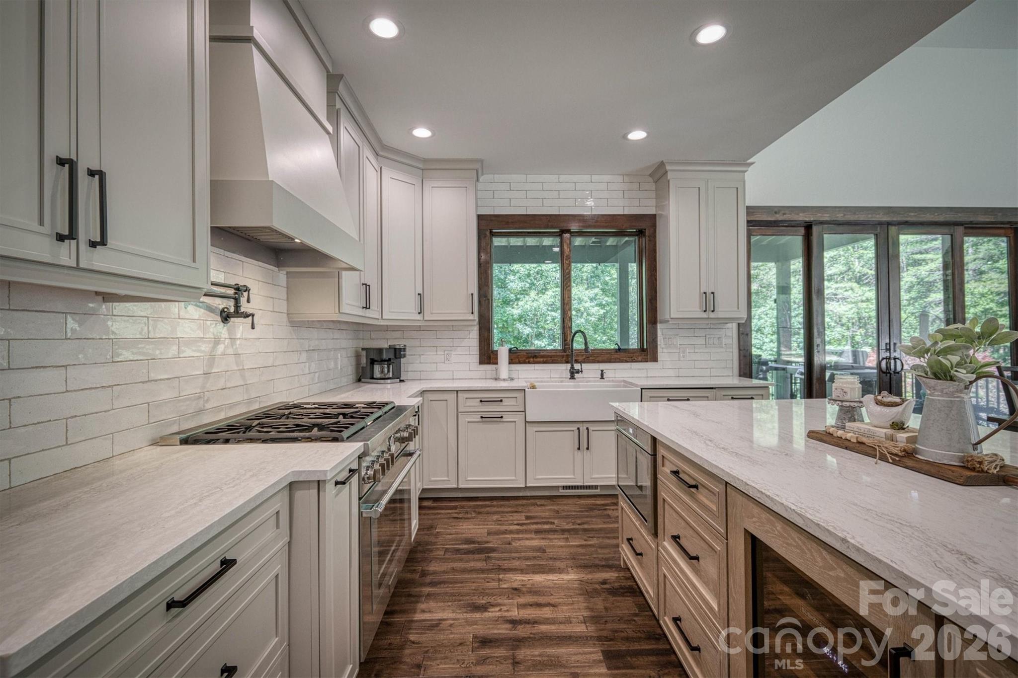 2243 Cottage Park Road Morganton, NC 28655 - Photo 15 of 48 a kitchen with a sink stove top oven and cabinets