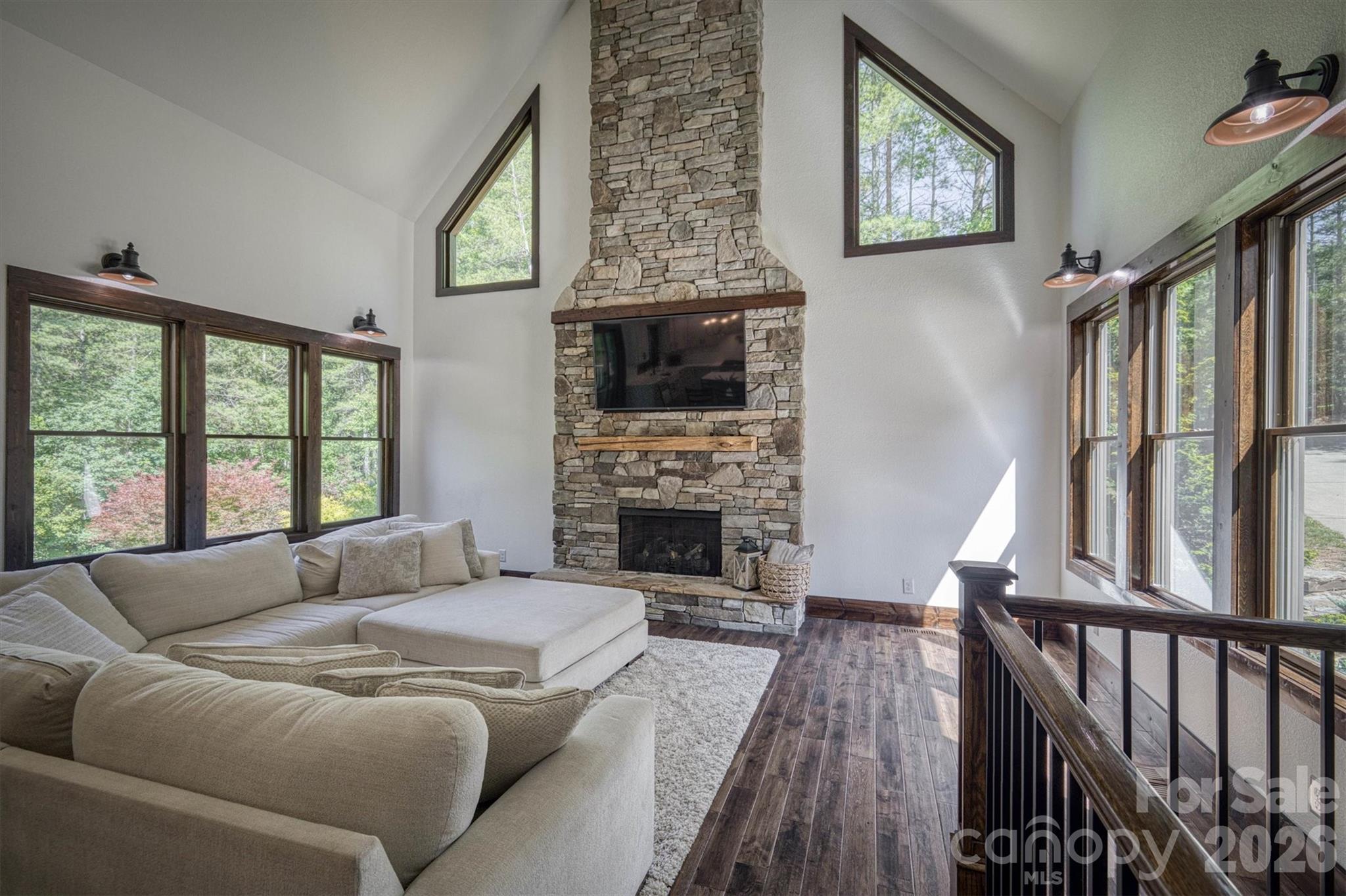 2243 Cottage Park Road Morganton, NC 28655 - Photo 18 of 48 a living room with fireplace furniture and a flat screen tv