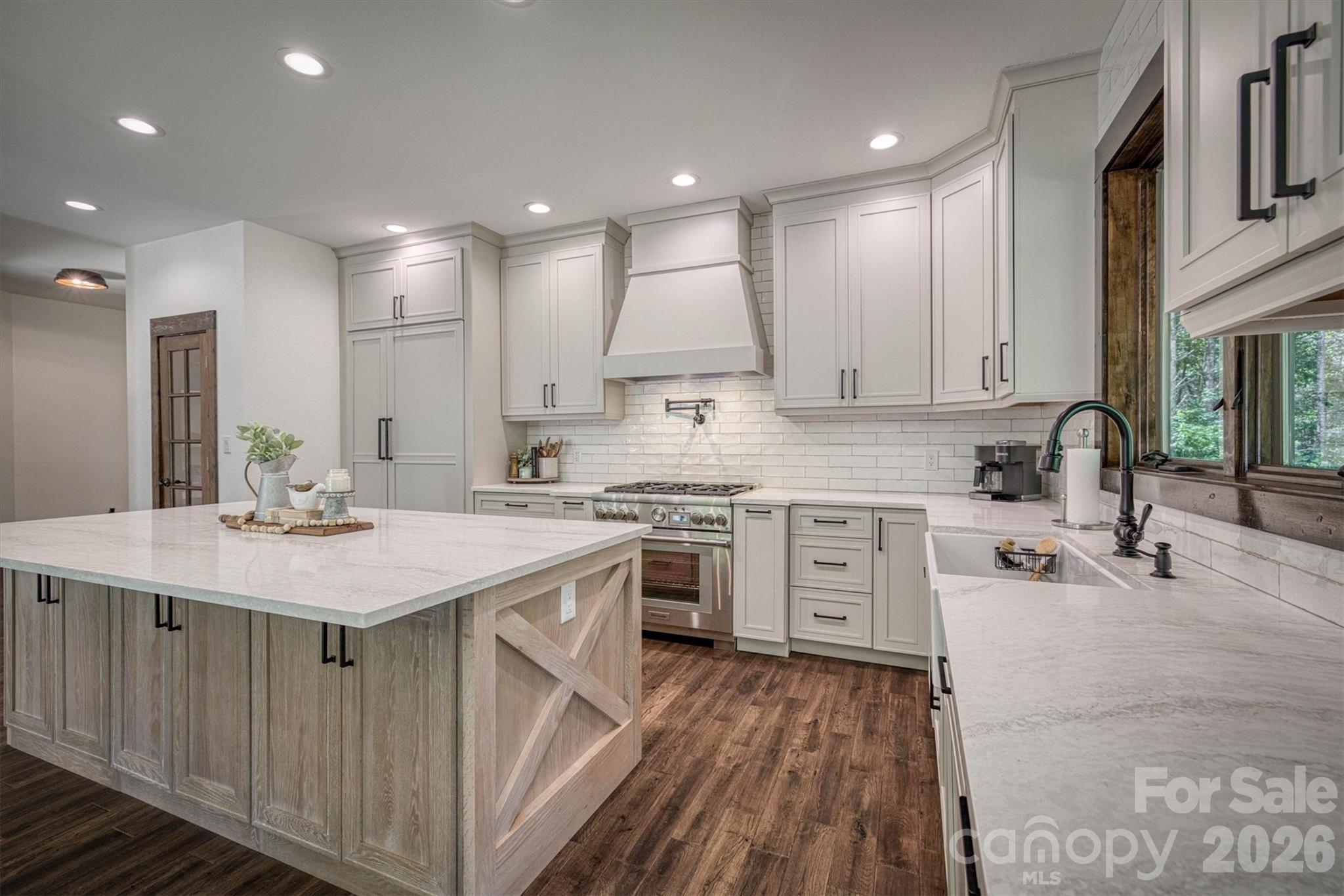 2243 Cottage Park Road Morganton, NC 28655 - Photo 20 of 48 a kitchen with a sink stove and cabinets