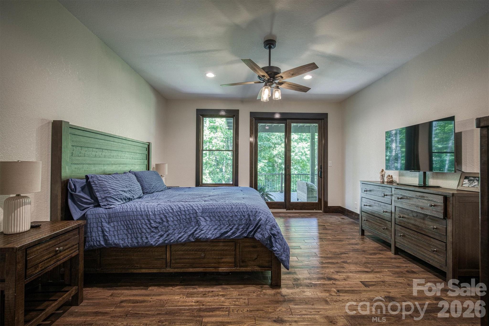2243 Cottage Park Road Morganton, NC 28655 - Photo 24 of 48 a bedroom with a large bed and a large window