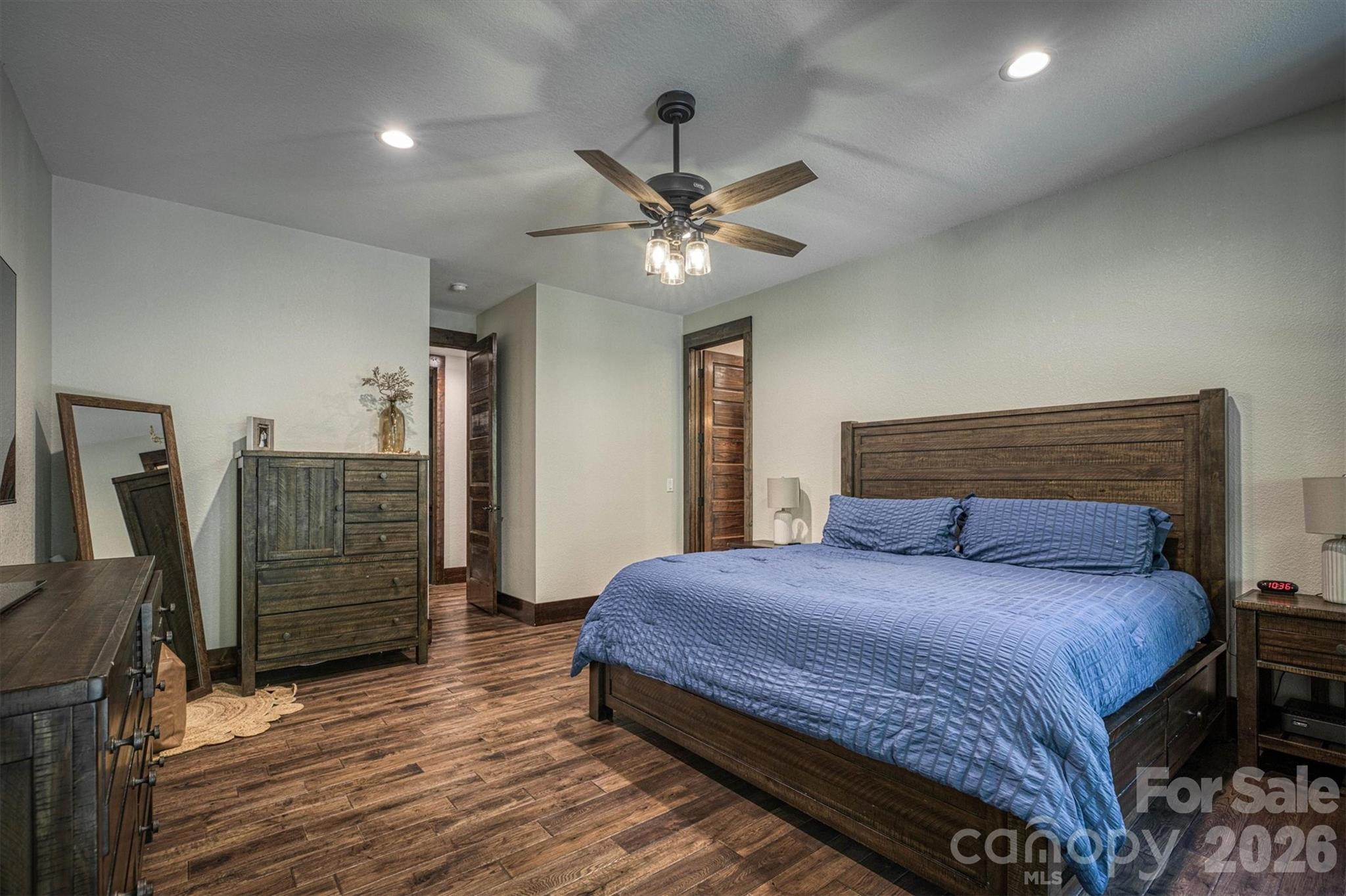 2243 Cottage Park Road Morganton, NC 28655 - Photo 25 of 48 a bedroom with a bed chandelier and a walk in closet