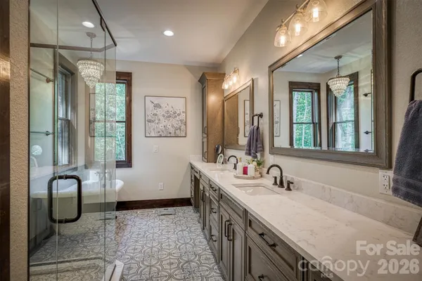 a spacious bathroom with a bathtub and next to a window
