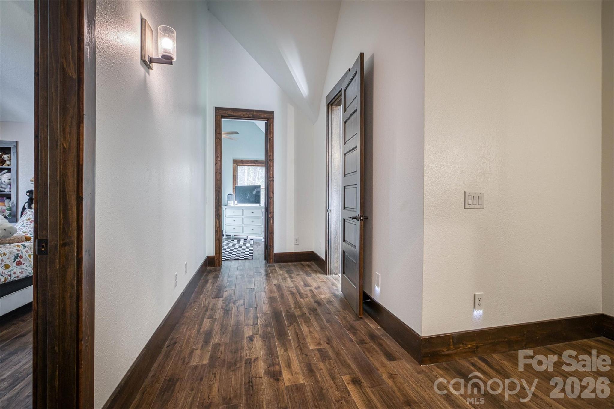 2243 Cottage Park Road Morganton, NC 28655 - Photo 32 of 48 a view of a hallway with wooden floor and a bathroom
