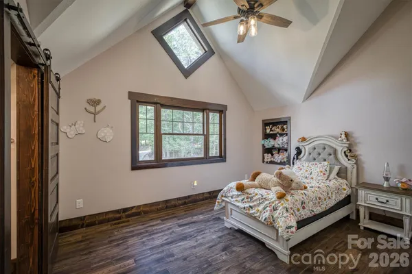 a bedroom with a bed and furniture