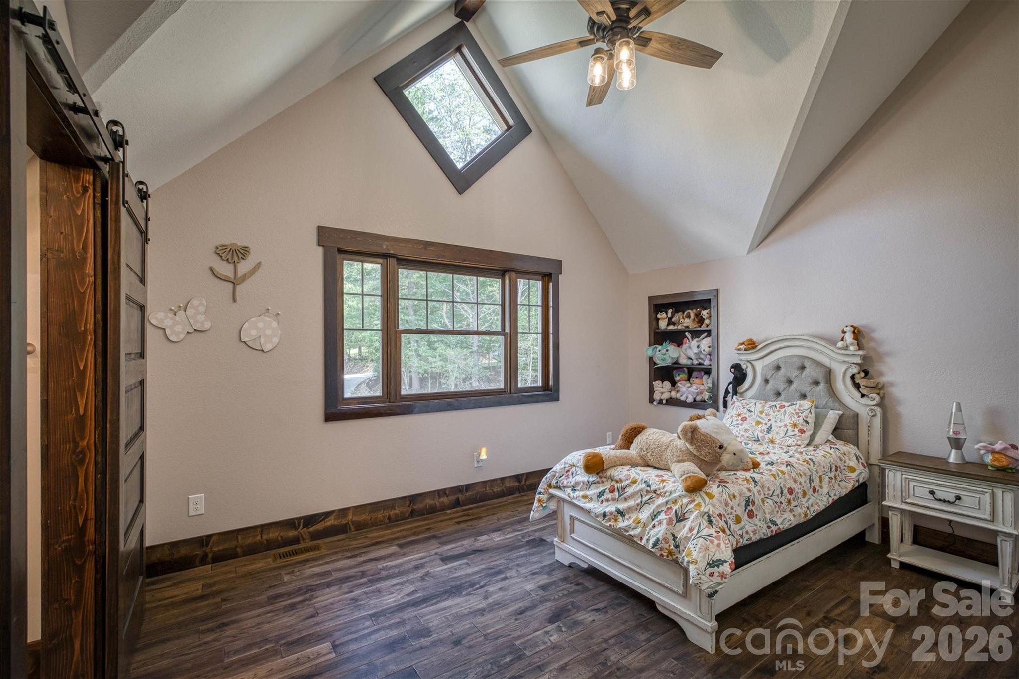 2243 Cottage Park Road Morganton, NC 28655 - Photo 40 of 48 a bedroom with a bed lamp and a window