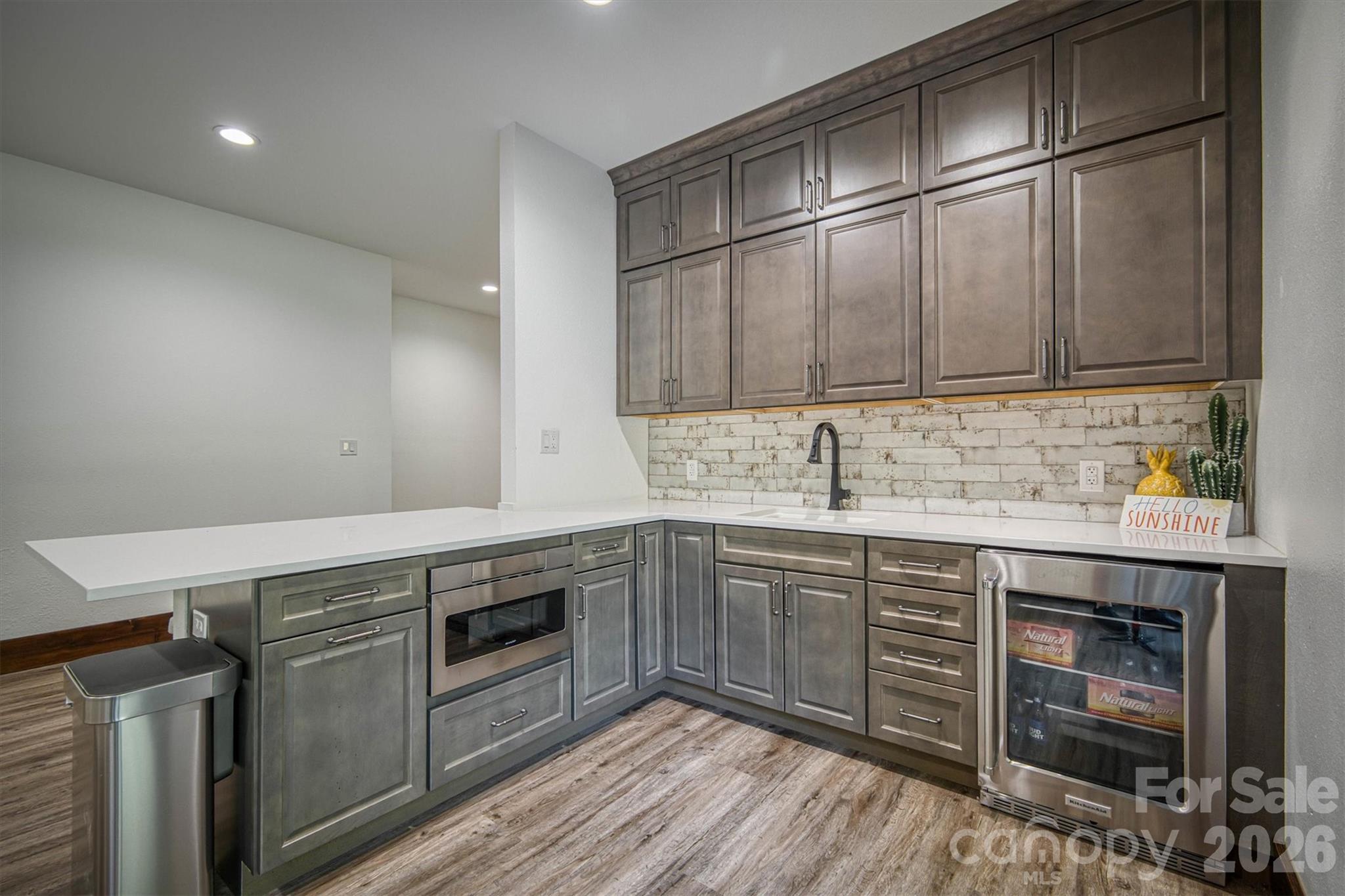 2243 Cottage Park Road Morganton, NC 28655 - Photo 44 of 48 a kitchen with stainless steel appliances granite countertop a sink and cabinets