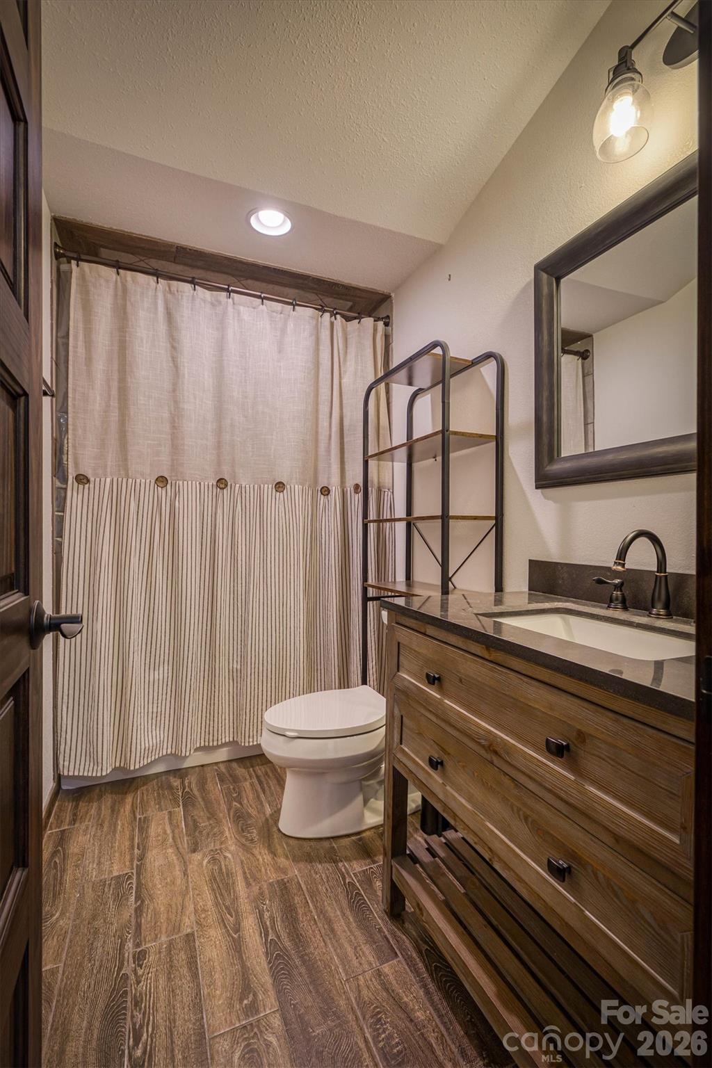 2243 Cottage Park Road Morganton, NC 28655 - Photo 48 of 48 a bathroom with a sink and a mirror