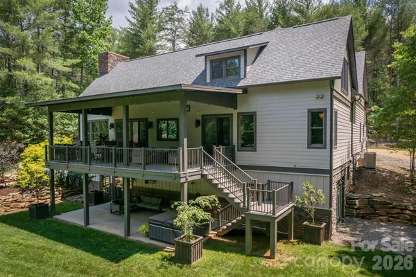 a house view with a sitting space garden and outdoor seating