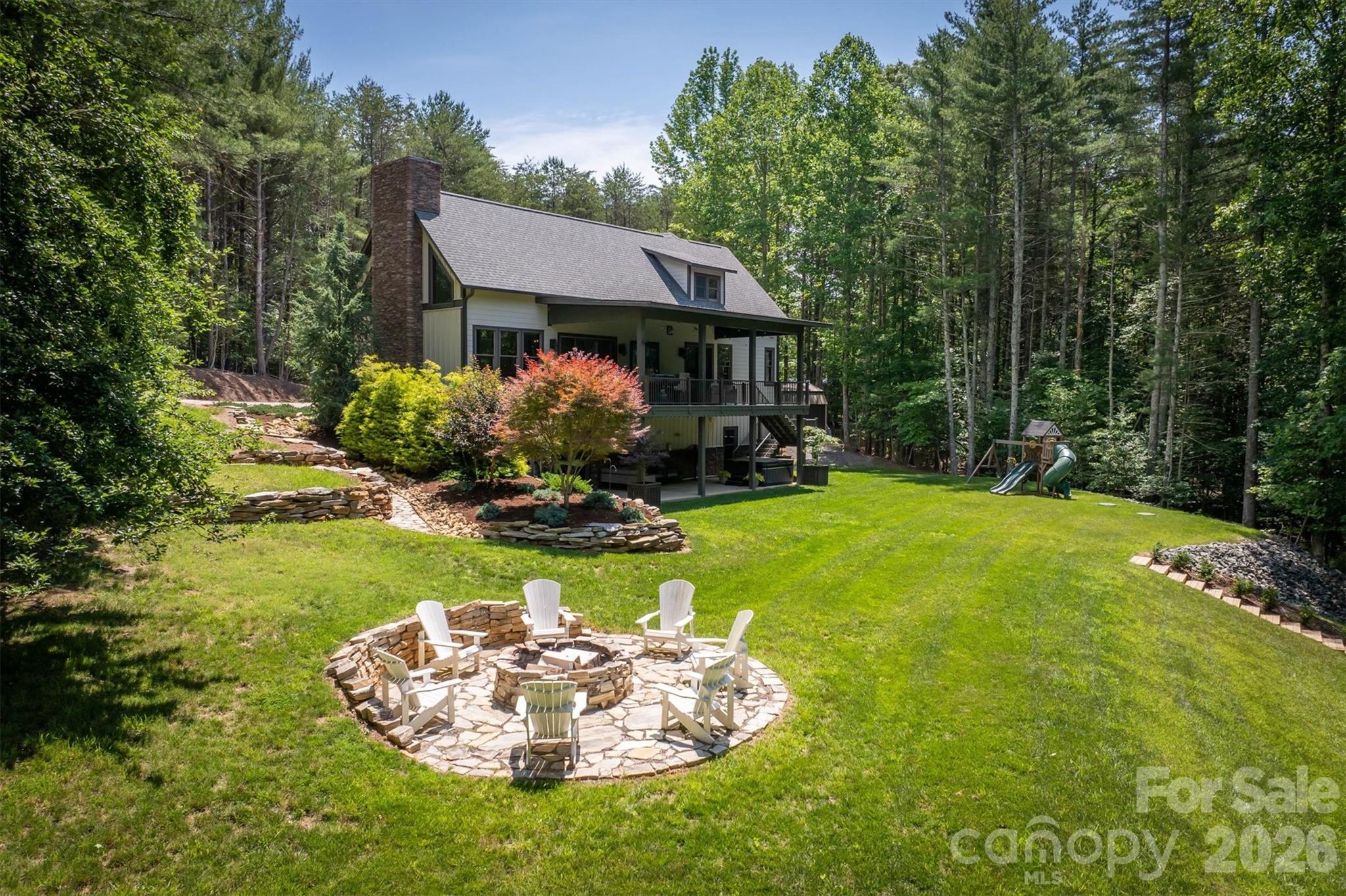 2243 Cottage Park Road Morganton, NC 28655 - Photo 8 of 48 a house with a big yard and a fountain