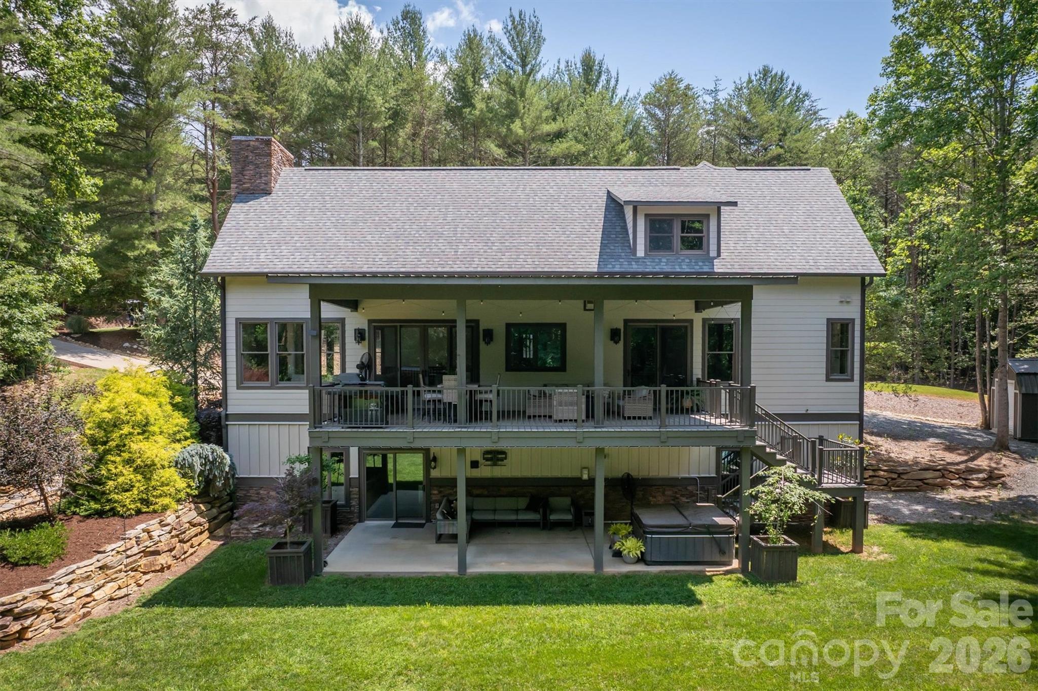 2243 Cottage Park Road Morganton, NC 28655 - Photo 10 of 48 a view of a house with backyard sitting area and swimming pool