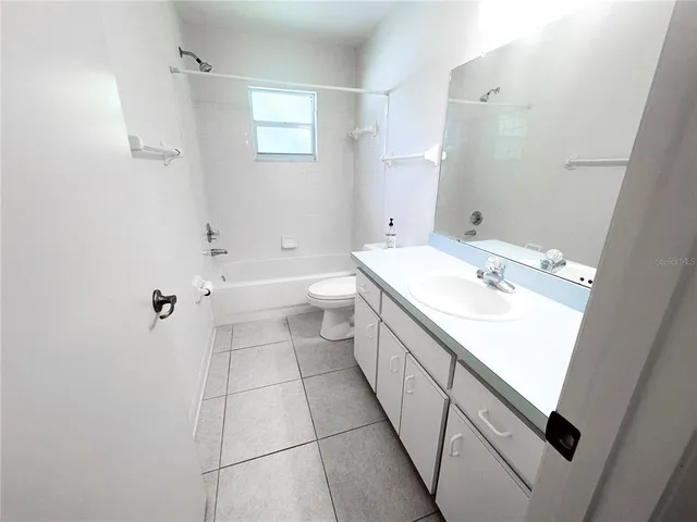a bathroom with a sink a toilet and a bathtub