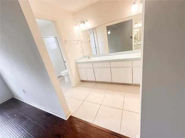 a view of a bathroom with sink and mirror