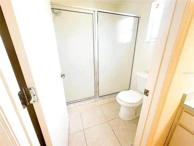 a bathroom with a shower and a toilet