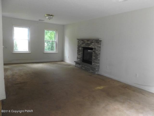 6155 Horatio Road Tobyhanna, PA 18466 - Photo 4 of 10 an empty room with windows