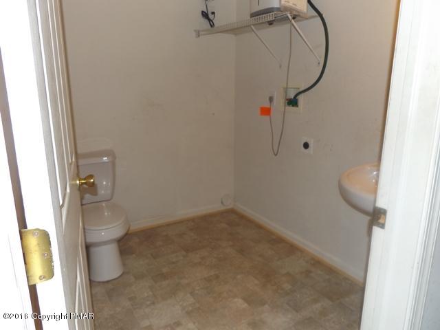 6155 Horatio Road Tobyhanna, PA 18466 - Photo 7 of 10 a bathroom with a shower and toilet