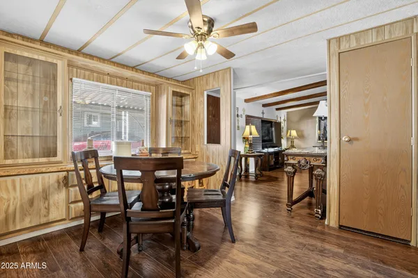 a view of a dining room with furniture window and wooden floor