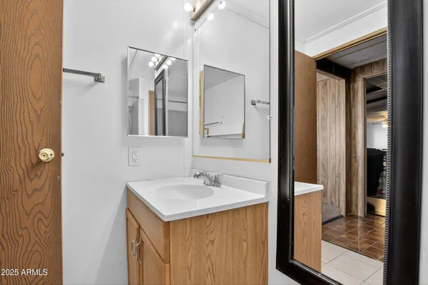 a bathroom with a sink and a mirror